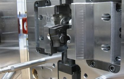 capabilities injection mold with four slides and ejecting core