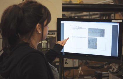 injection-molding-capabilities-molding-technician-reviewing-work-instructions injection molding capabilities molding technician reviewing work instructions